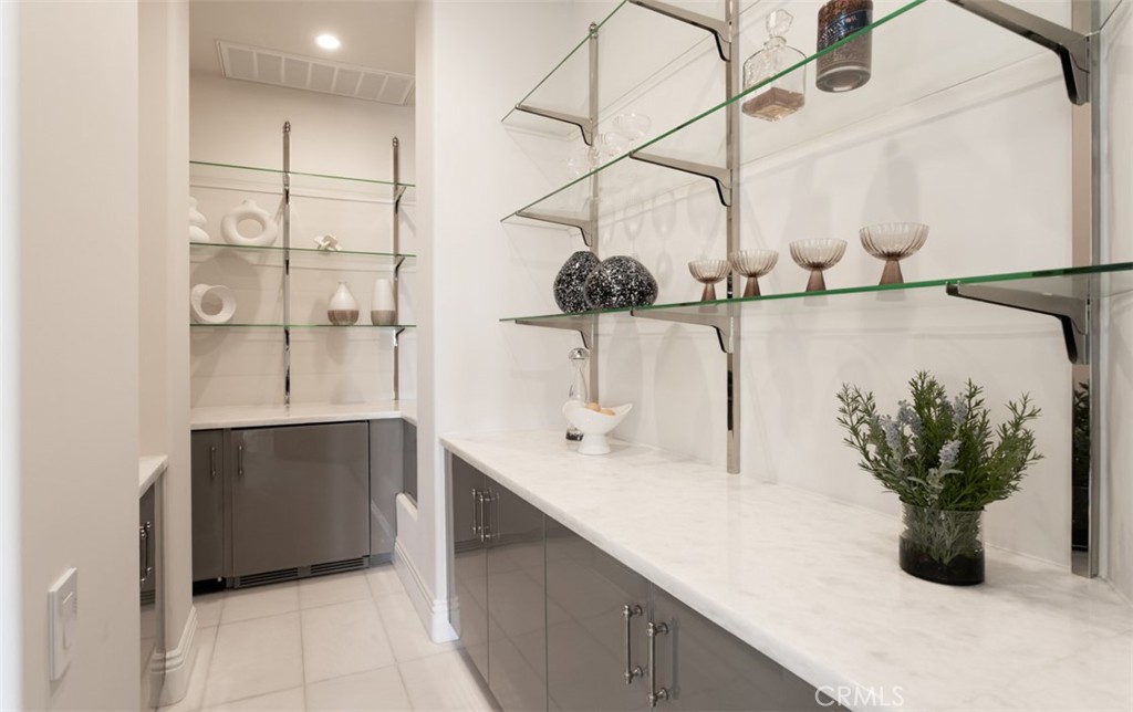 22 Pelican Crest Drive Newport Coast, CA 92657 - Photo 27 of 66 a bathroom with a sink and mirror