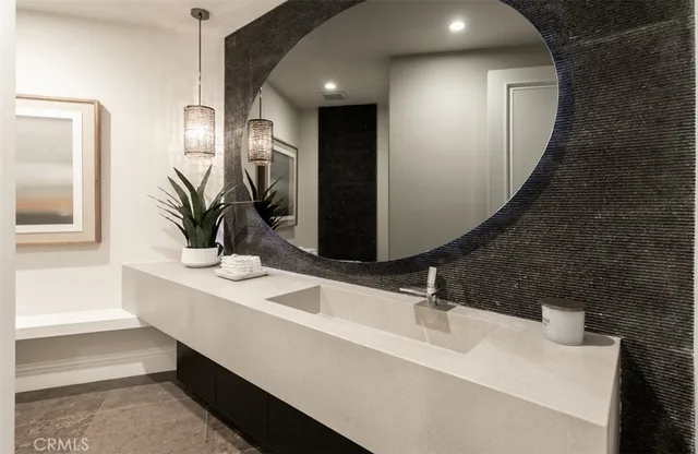 a living room with furniture flat screen tv and white walls