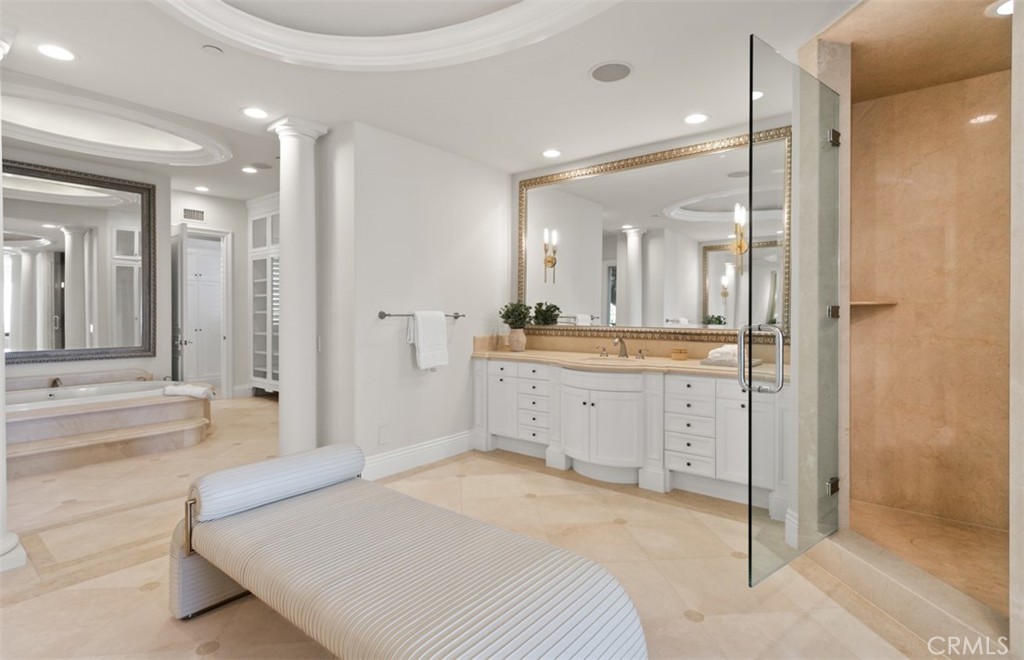 22 Pelican Crest Drive Newport Coast, CA 92657 - Photo 38 of 66 a spacious bathroom with a mirror sink and shower