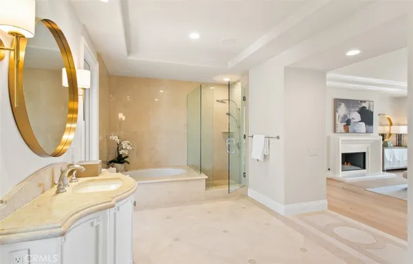a view of a kitchen with a sink and a refrigerator