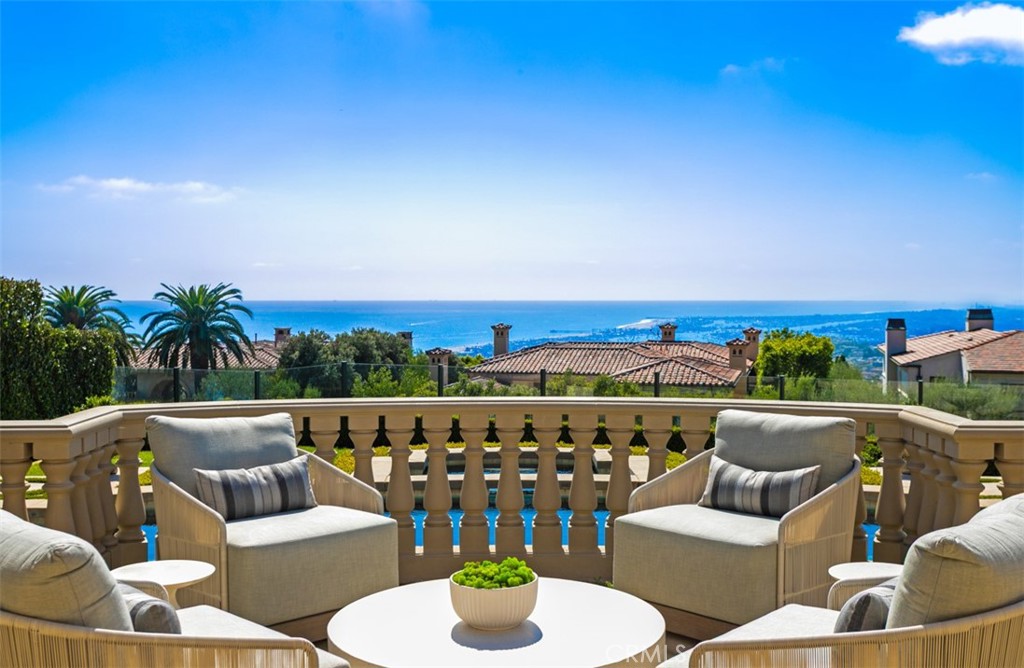 22 Pelican Crest Drive Newport Coast, CA 92657 - Photo 64 of 66 a balcony with furniture and city view
