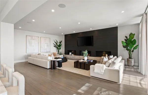 a living room with furniture fireplace and a flat screen tv