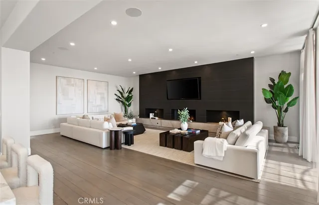 a living room with furniture fireplace and a flat screen tv