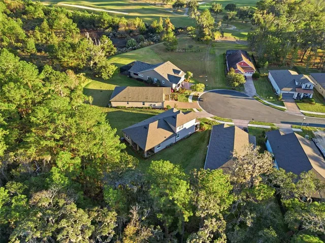 an aerial view of a house with a lake view