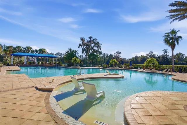 a view of a patio with dining table and chairs with a potted plants