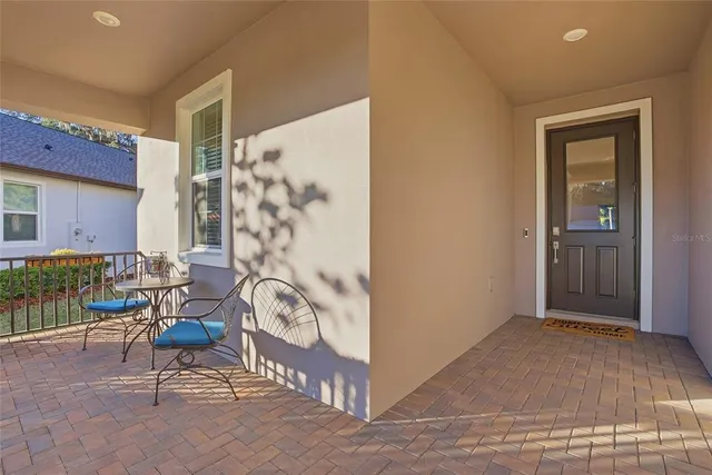a living room with furniture and a black gate