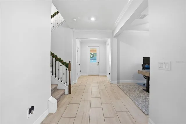 a view of a hallway with a room