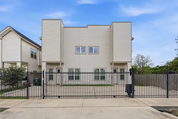 a view of a house with a fence