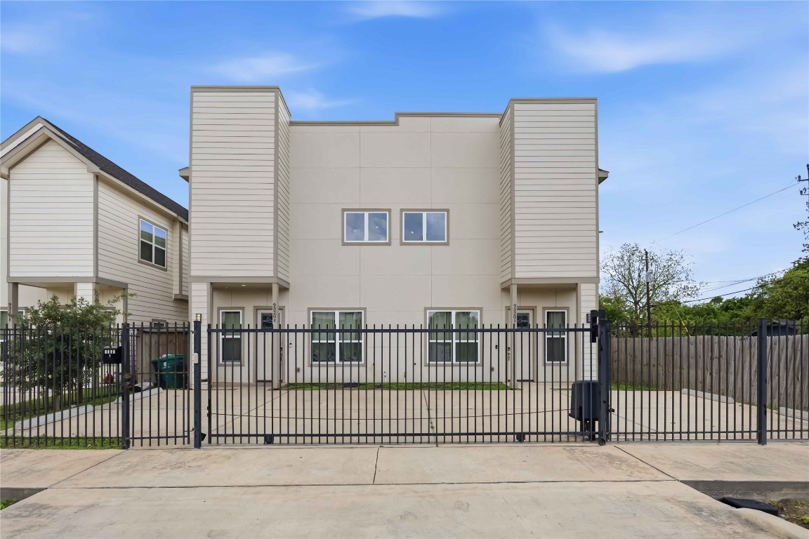a view of a house with a fence