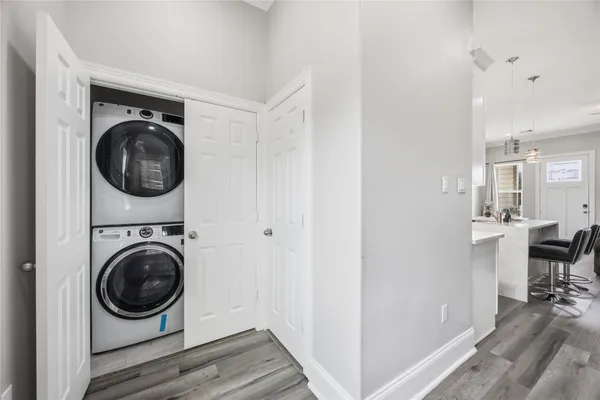 a view of a hallway with washer and dryer