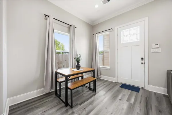 a view of a room with furniture window and wooden floor