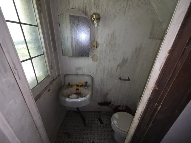 a bathroom with a sink toilet and tub