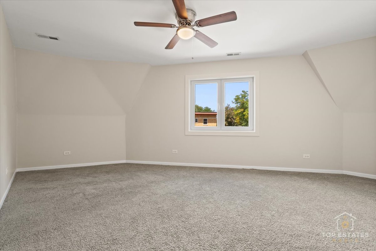 414 Franklin Avenue, Unit 3A River Forest, IL 60305 - Photo 16 of 29 an empty room with windows and fan