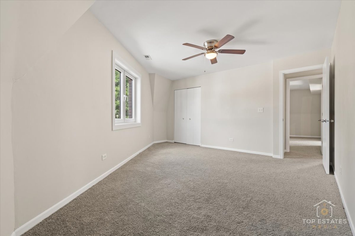 414 Franklin Avenue, Unit 3A River Forest, IL 60305 - Photo 17 of 29 a view of a livingroom with a ceiling fan and window