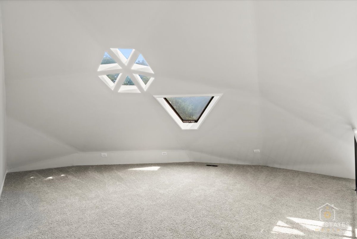 414 Franklin Avenue, Unit 3A River Forest, IL 60305 - Photo 20 of 29 an empty room with a chandelier fan and windows