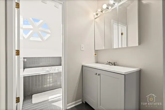 a bathroom with a bathtub and a toilet