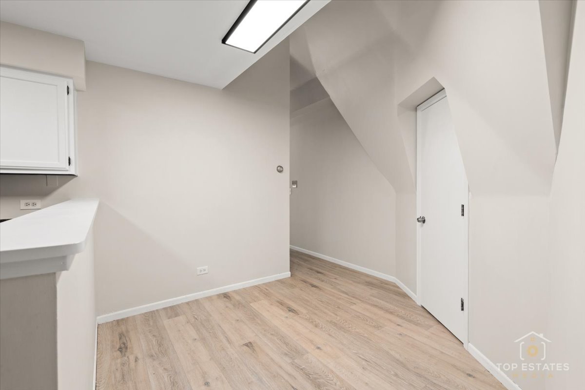 414 Franklin Avenue, Unit 3A River Forest, IL 60305 - Photo 10 of 29 a view of an empty room with wooden floor