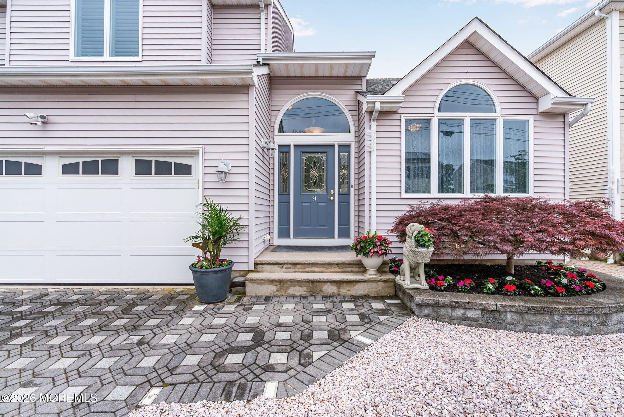 9 Cross Trees Road Brick, NJ 08723 - Photo 121 of 126 a front view of a house with a yard and a garage