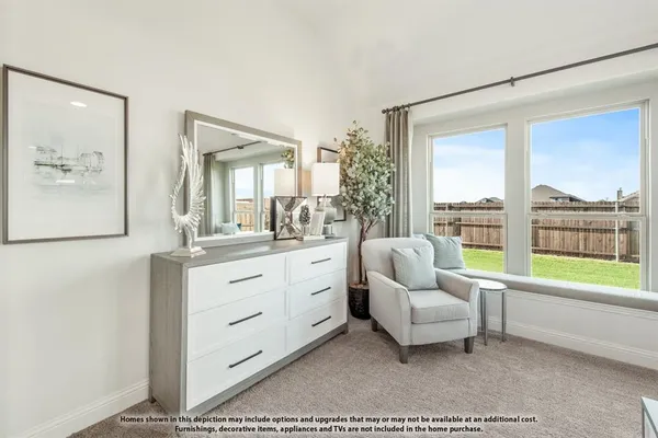 a spacious bedroom with a bed and large window