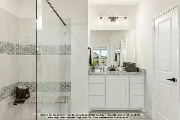 a bathroom with a sink a mirror and shower