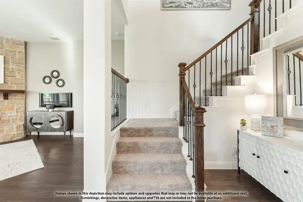 a view of living room kitchen and entryway