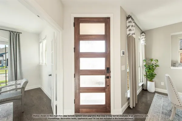 a view of a livingroom with furniture and front door