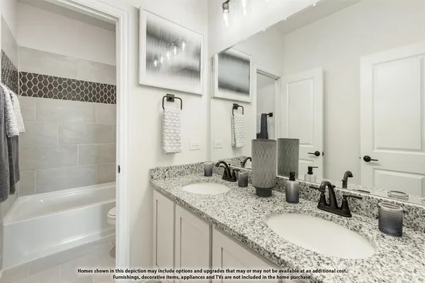 a bathroom with a granite countertop sink mirror and a