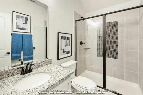 a bathroom with a granite countertop sink a mirror and shower
