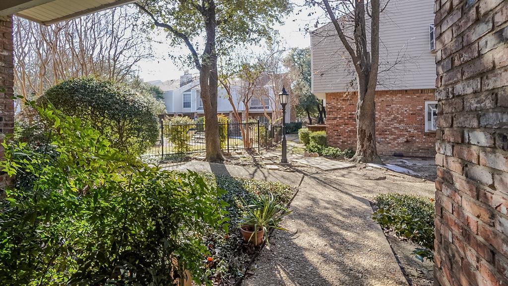 12921 Abrams Road, Unit 505 Dallas, TX 75243 - Photo 19 of 24 a view of a yard with plants and large trees