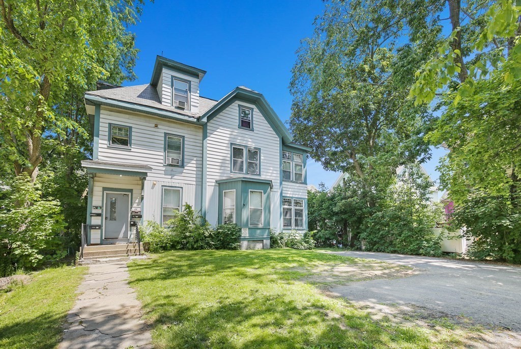 26 Sever Street Worcester, MA 01609 - Photo 1 of 40 a front view of a house with a yard