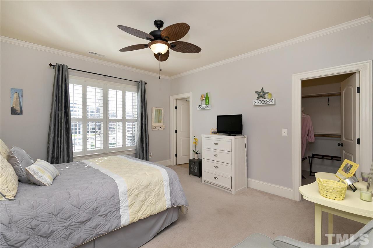 2829 Winter Song Road Raleigh, NC 27614 - Photo 22 of 30 ALL BEDROOMS HAVE A BATHROOM. WALK IN CLOSET WITH BUILT IN WOOD SHELVING.