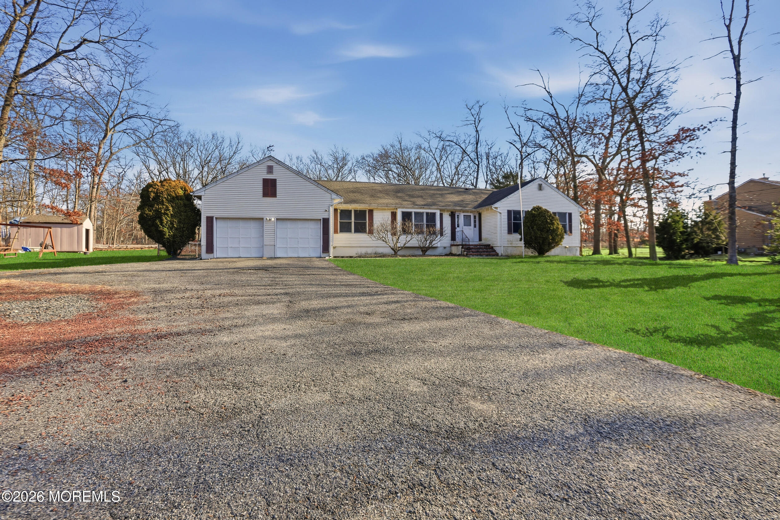 153 South Hope Chapel Road Jackson, NJ 08527 - Photo 3 of 10 a front view of a house with a yard and trees