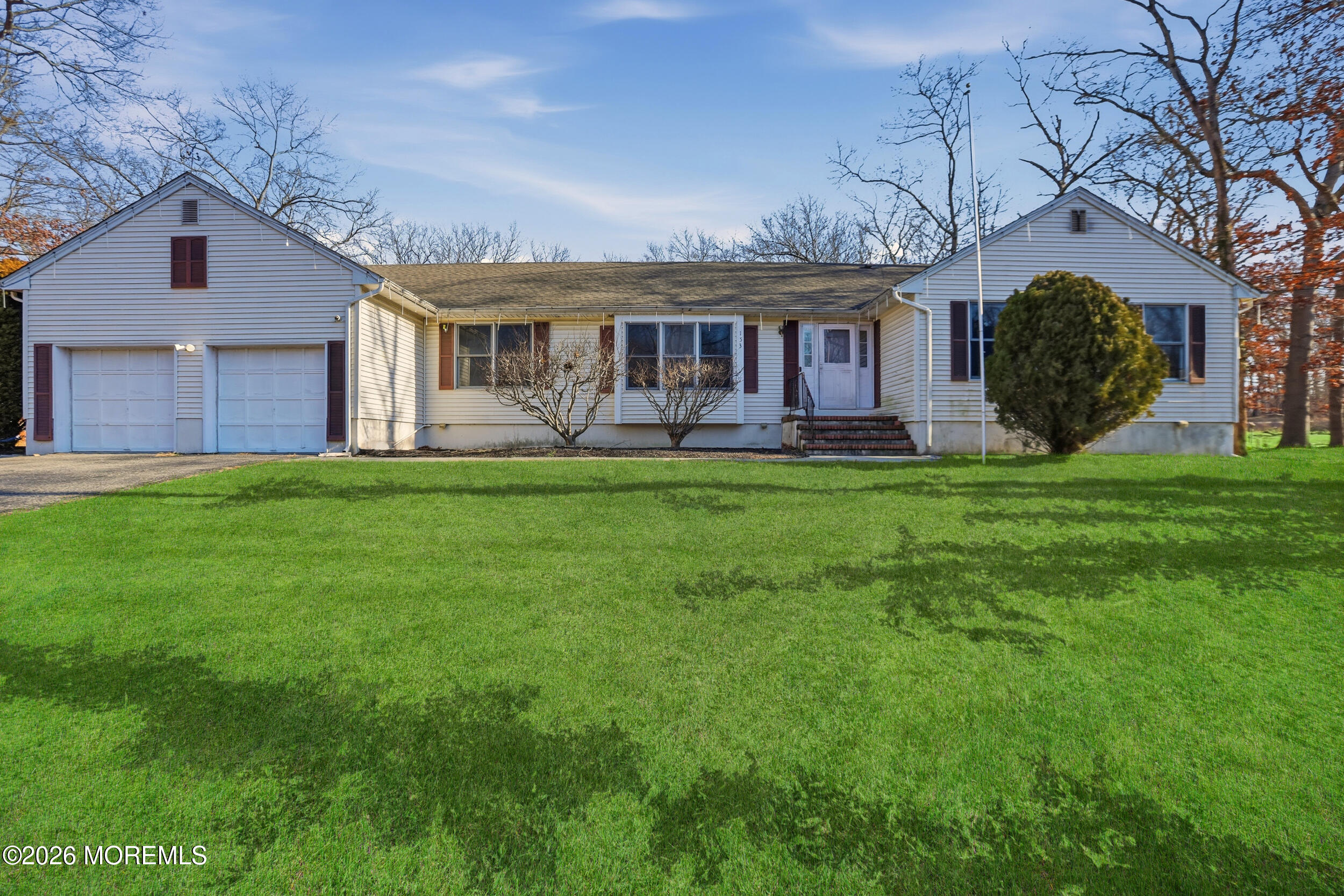 153 South Hope Chapel Road Jackson, NJ 08527 - Photo 4 of 10 a front view of a house with a garden and yard