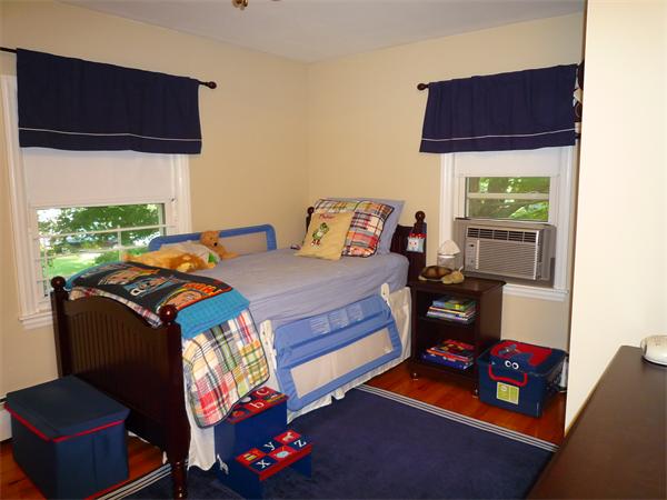 9 Bridge Street Lexington, MA 02421 - Photo 11 of 20 a bedroom with a bed and a window