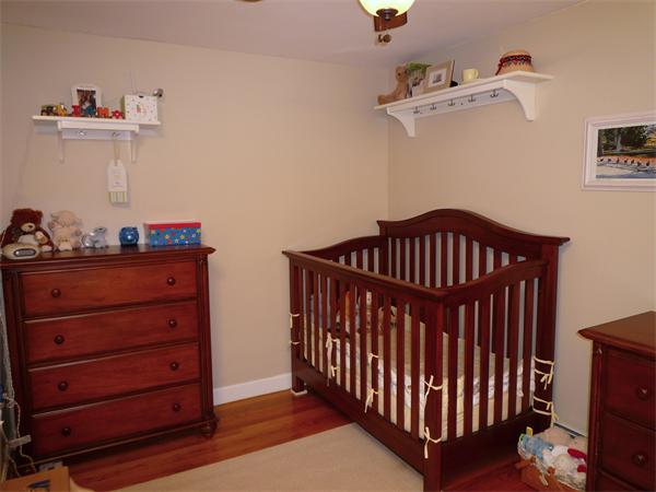 9 Bridge Street Lexington, MA 02421 - Photo 12 of 20 a view of a bedroom with baby crib