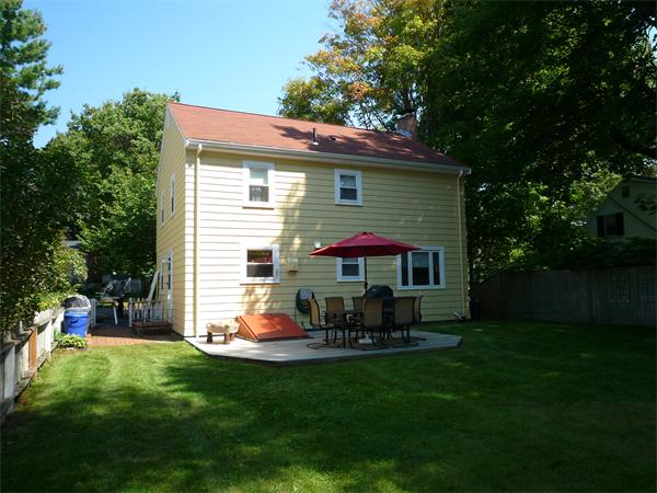 9 Bridge Street Lexington, MA 02421 - Photo 17 of 20 a view of house with outdoor seating and yard