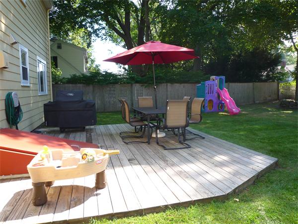 9 Bridge Street Lexington, MA 02421 - Photo 19 of 20 a view of outdoor space yard deck patio and outdoor kitchen