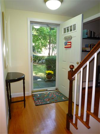 9 Bridge Street Lexington, MA 02421 - Photo 2 of 20 a view of an entryway with a floor to ceiling window