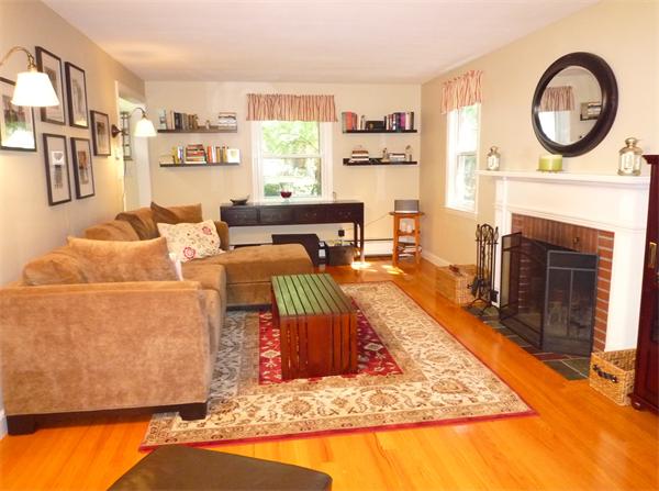 9 Bridge Street Lexington, MA 02421 - Photo 4 of 20 a living room with furniture a rug and a fireplace
