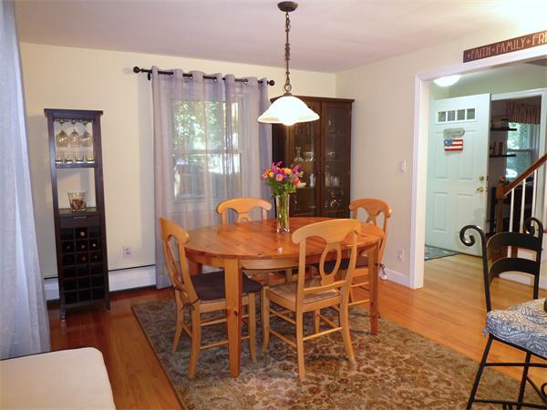 9 Bridge Street Lexington, MA 02421 - Photo 5 of 20 a dining room with furniture window entryway and wooden floor