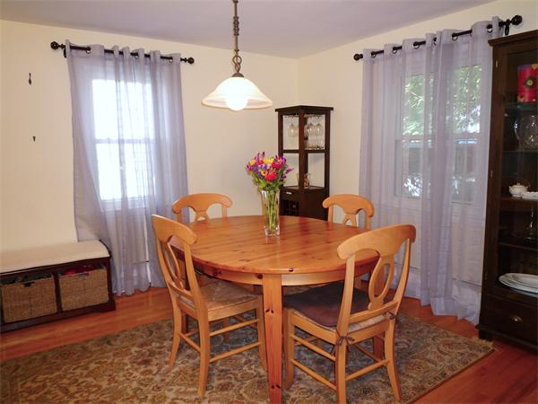 9 Bridge Street Lexington, MA 02421 - Photo 6 of 20 a view of a dining room with furniture window and wooden floor