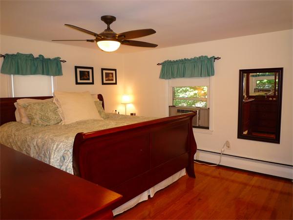 9 Bridge Street Lexington, MA 02421 - Photo 9 of 20 a living room with a bed furniture and a window