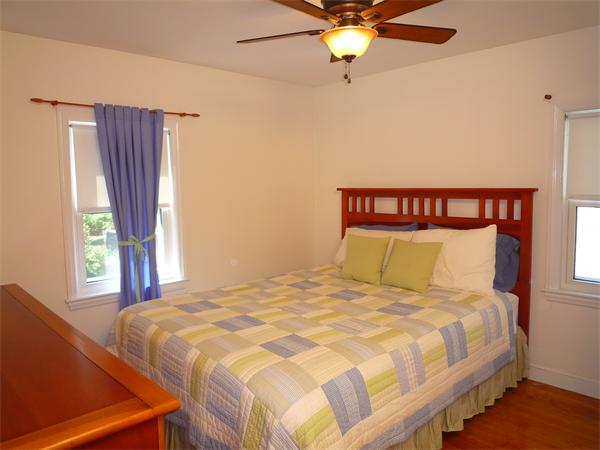 9 Bridge Street Lexington, MA 02421 - Photo 10 of 20 a large bed sitting in a bedroom next to a window