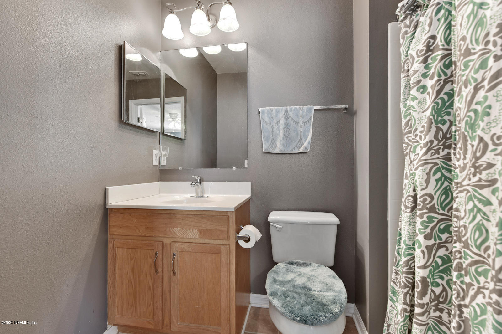 55371 Bear Run Road Callahan, FL 32011 - Photo 24 of 29 a bathroom with a toilet sink and mirror