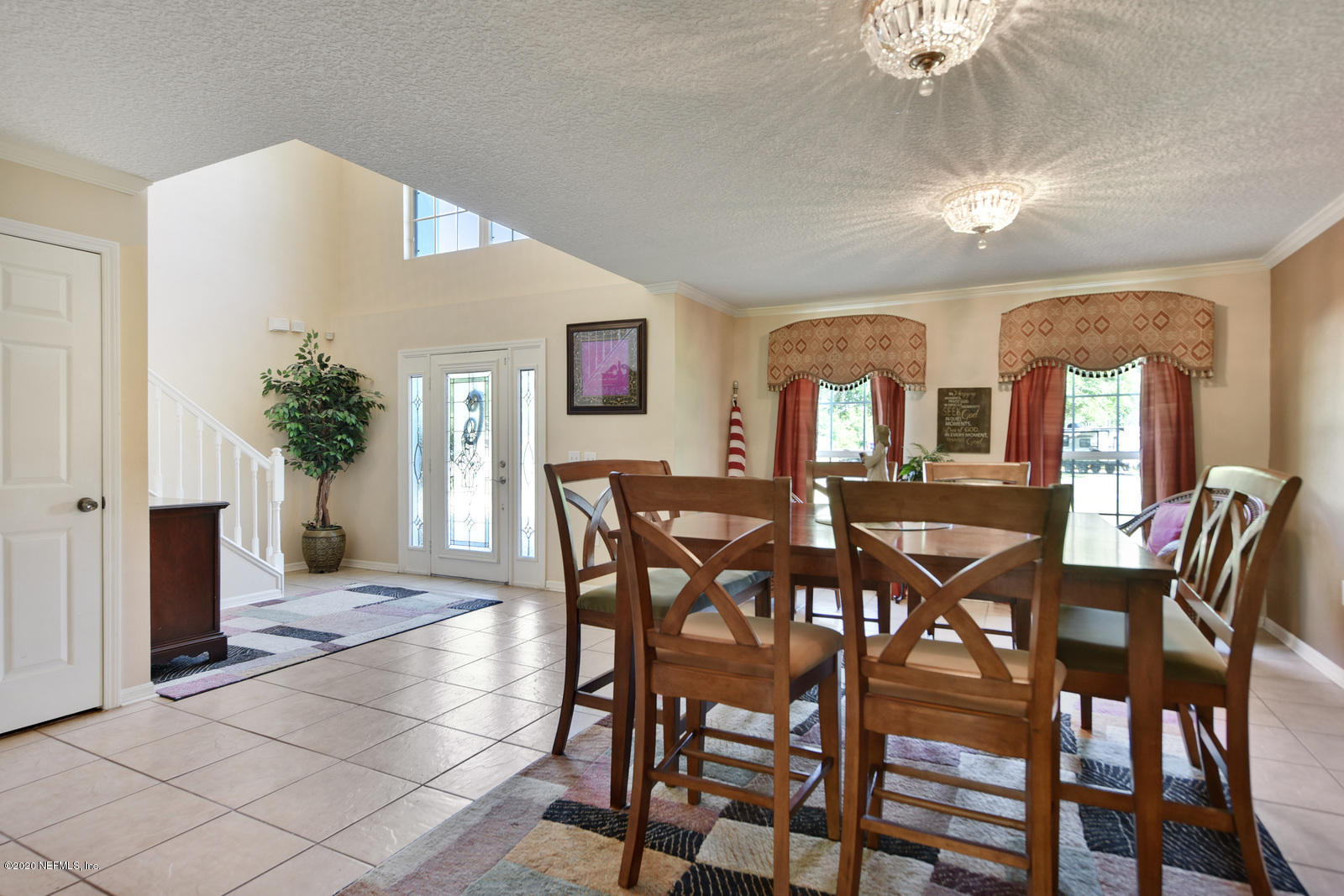 55371 Bear Run Road Callahan, FL 32011 - Photo 6 of 29 a view of a dining room with furniture and a chandelier