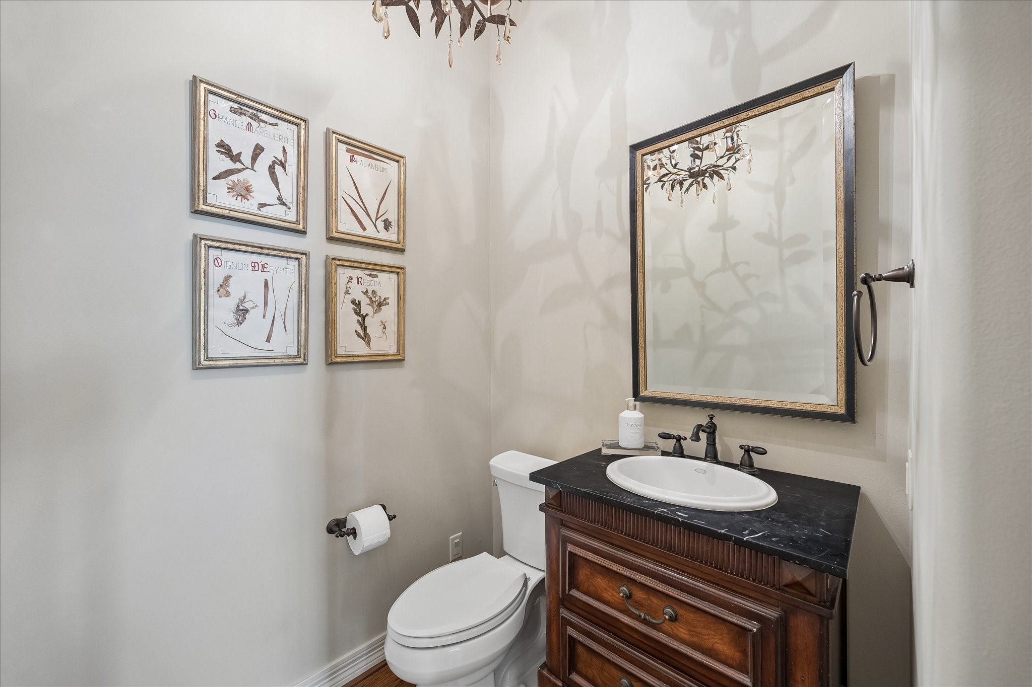 802 Anderson Street Bellaire, TX 77401 - Photo 32 of 36 Powder bath on the first floor just before the stairs.