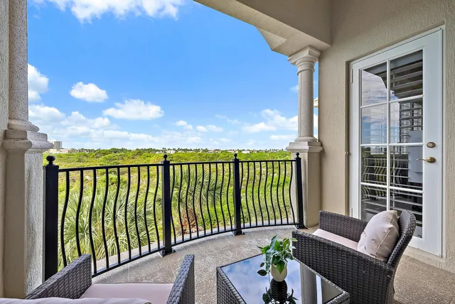 a view of balcony with furniture