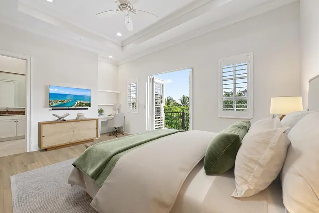 a bedroom with a large bed and a window