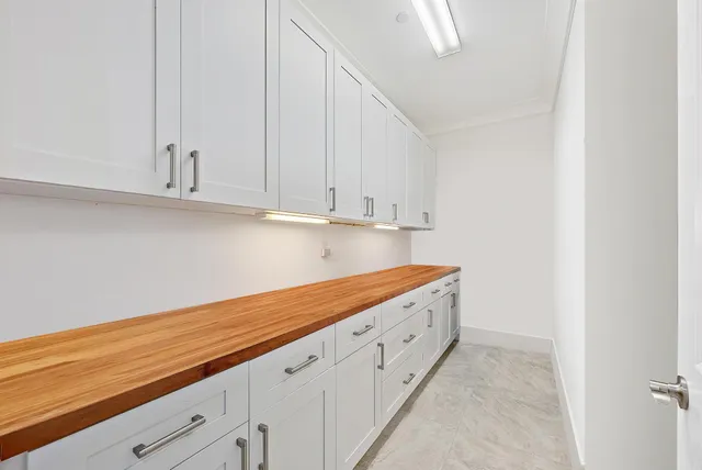 a view of cabinets with wooden floor