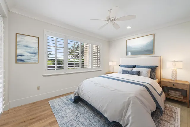 a bedroom with a large bed and a window